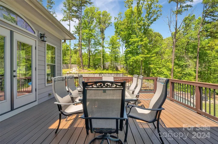 Upper deck, off of kitchen, connecting to covered porch