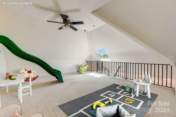 Playroom fun with scuttle hole down to bedroom, perfect for bunk bed placement.