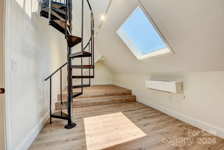 Playroom access with spiral staircase
