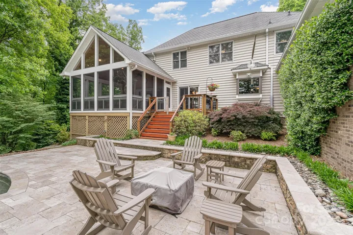 Back patio with fire pit which stays