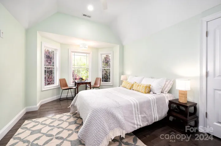 Upper level guest bedroom with waterfall views