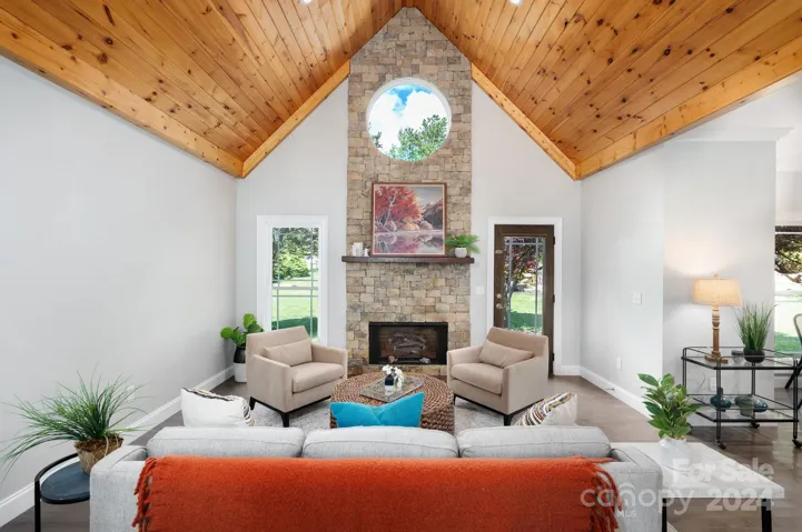 Vaulted tongue and groove ceiling living room on main level