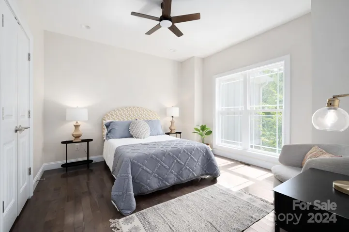 Main-level guest bedroom with double closets