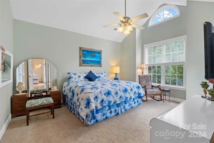 Large main level primary suite with bay window and cathedral ceilings