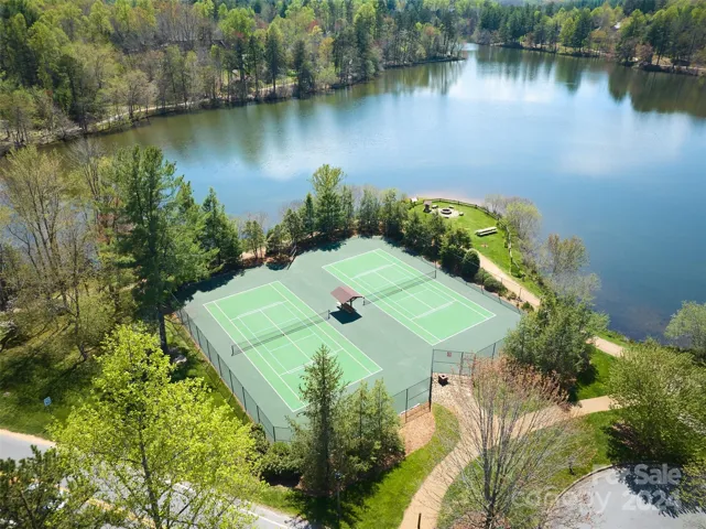 2 private tennis courts/pickleball courts for owners and guests located adjacent to the lake and walking trails