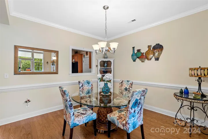 Dining room with mouldings and kitchen pass through