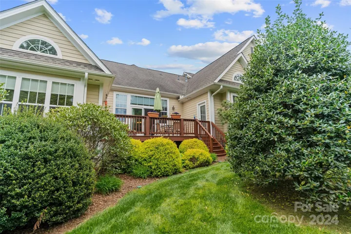 Rear yard is private and beautifully landscaped