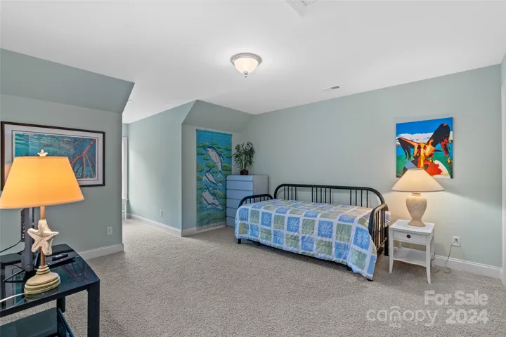 Large guest bedroom with light filled dormer