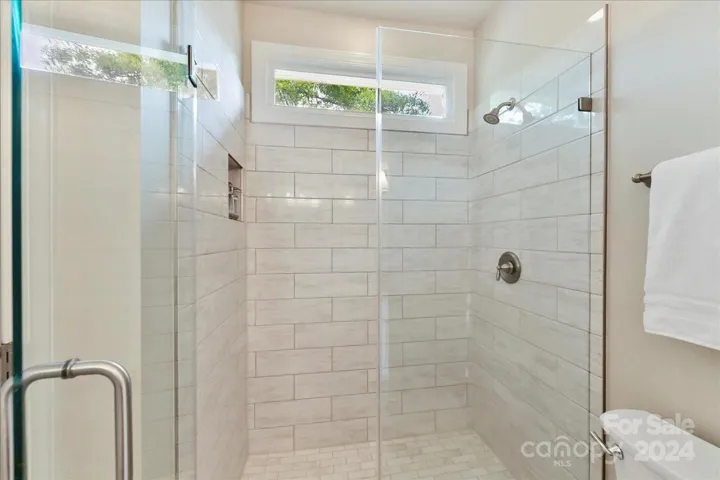 Jack and Jill Bath with Remodeled Shower and Frameless Door