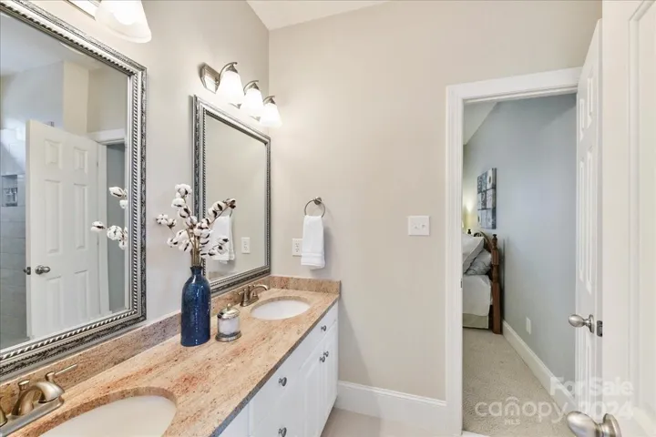 Framed Mirrors, Dual Sinks and Granite in Jack and Jill Bath