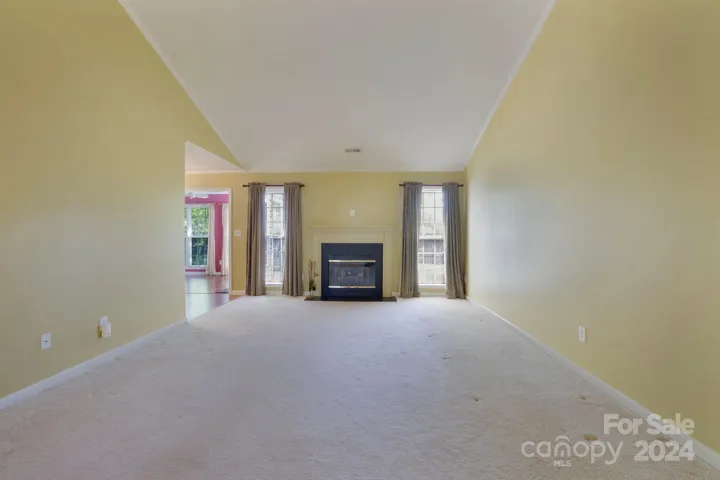 Open living room w/ cathedral ceilings