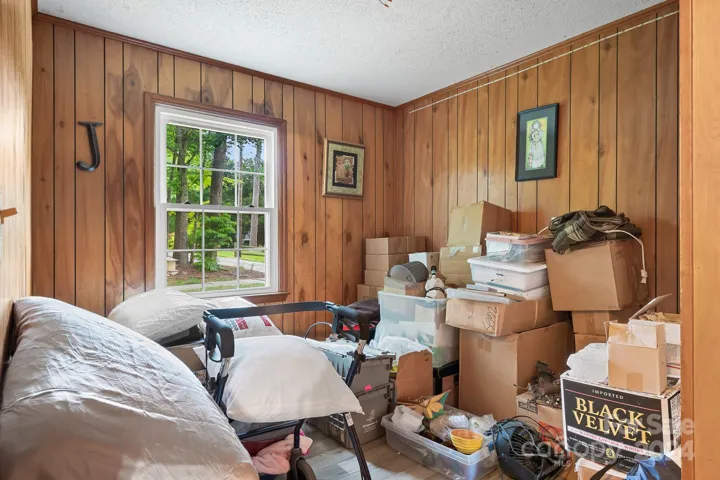 Bedroom 3 currently used as storage for moving items.