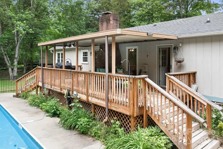 Covered Deck overlooks pool area.