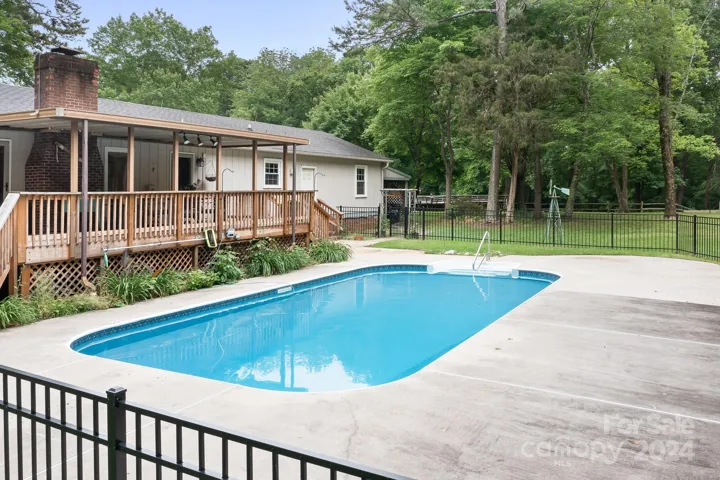 Sparkling salt-water pool ready for summer! Extra patio space for table and chairs too.