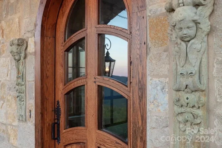 Detail of the stunning front door and stone sculptures. Note the reflection in the glass - opposite the front door is an absolutely incredible long range view featuring Mount Mitchell, the tallest peak east of the Rockies.