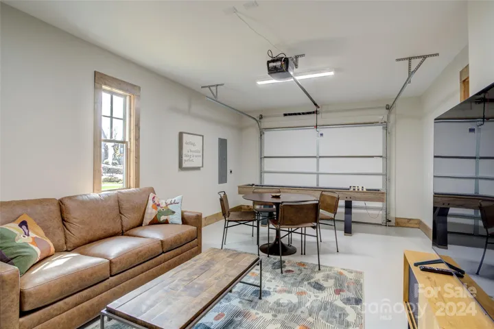 Garage at entry level has been creatively turned into a den and game room