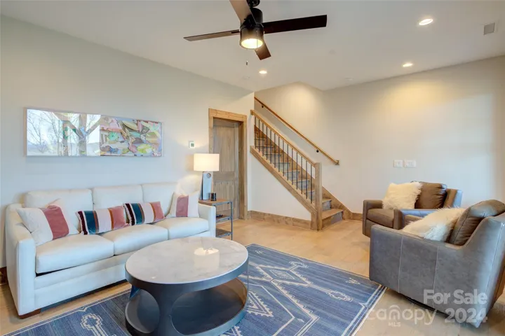 Lower level/basement bedroom w/ensuite bath is currently used as a den. Mechanical closet is located left of the stairway & is also used for extra storage.