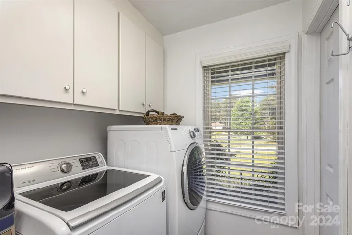 Laundry Room with a laundry sink and 2 entrances on the main floor