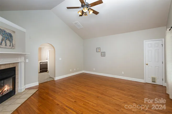 Gleaming hardwood floors and vaulted ceilings in the Living Room