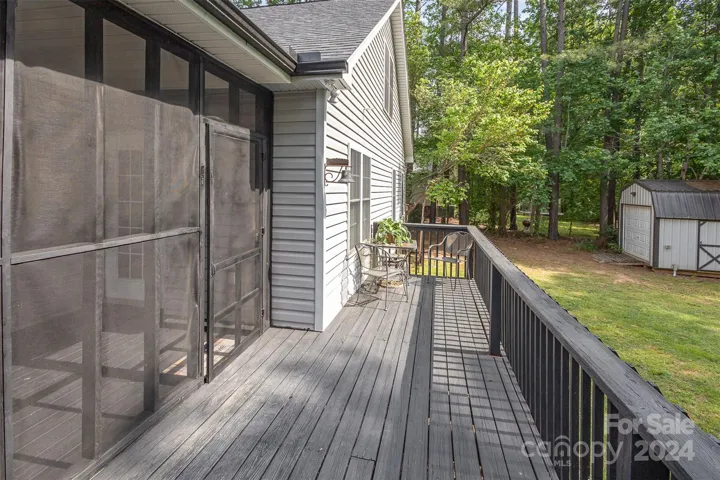 View of the deck overlooking the fenced backyard