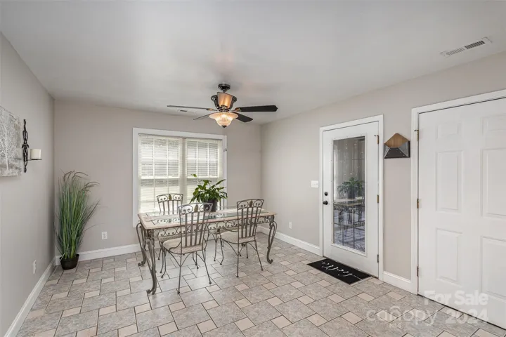 Large Dining Area which leads to the screened porch and views of the backyard