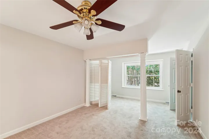 Guest bedroom with plantation shutters that move