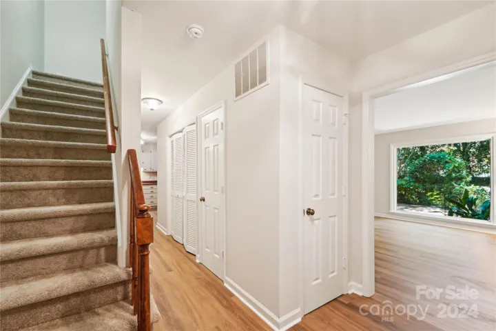 Foyer with view into living room and picture window