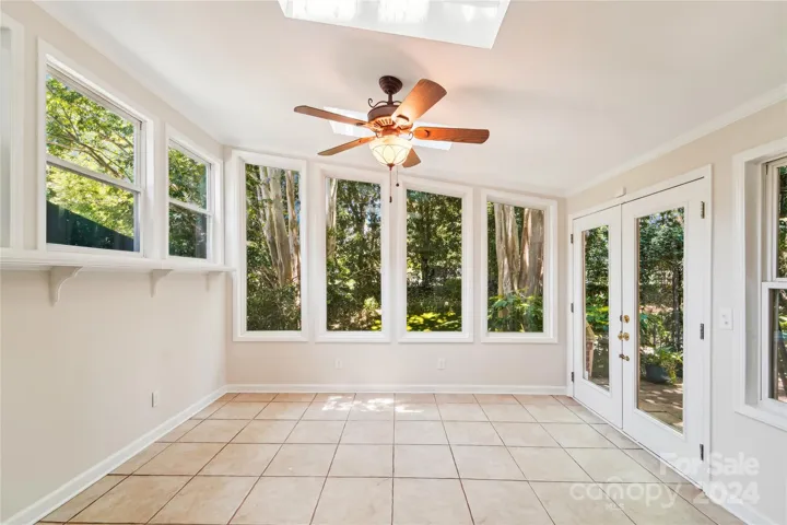 Sunroom with skylights, lots of windows