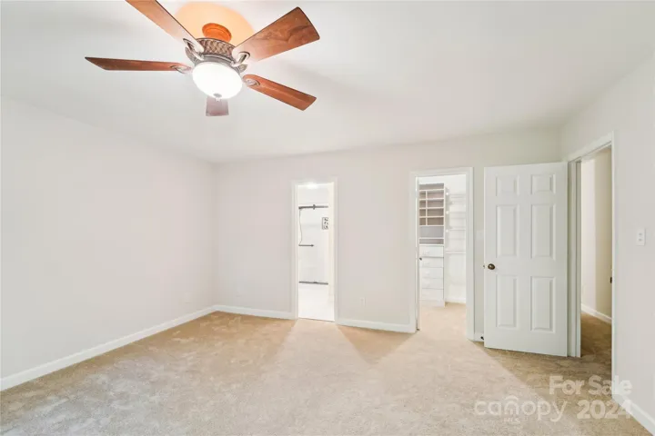 Master bedroom with views into master bath, closet and hallway