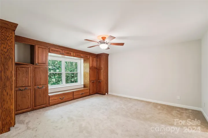 Master Bedroom with oak custom cabinets