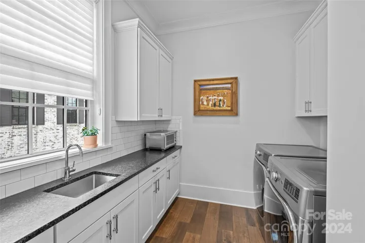 Laundry with granite countertops