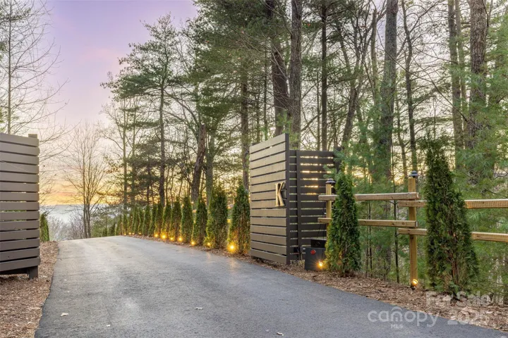 Property has lighted entrance, automated security gate, yard being fenced, Honeywell digital security system with cameras and remote monitoring protects your home while you’re away.