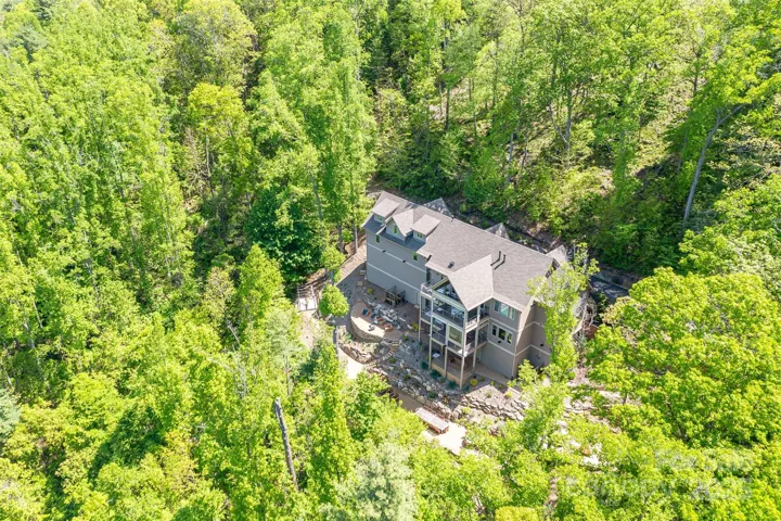 Located on one of only four private streets on Reynolds Mountain with Reynolds Mountain Nature Preserve and community hiking trails accessible from property. Very quiet and completely surrounded by nature year-round long-range mountain views to the west with sunsets.