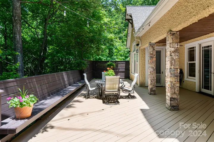Extensive back deck off screened patio and primary suite
