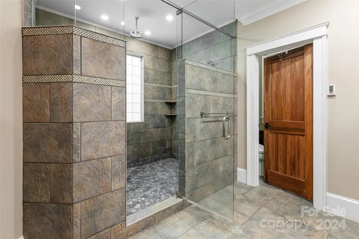 Large walk in shower with separate steam shower
