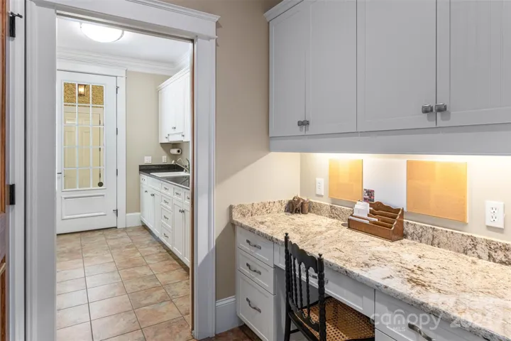 Separate desk area off laundry and mudroom