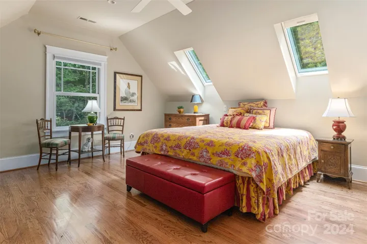 Upper level bedroom with skylights