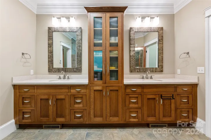 Double vanity with custom cabinetry & radiant heated floors