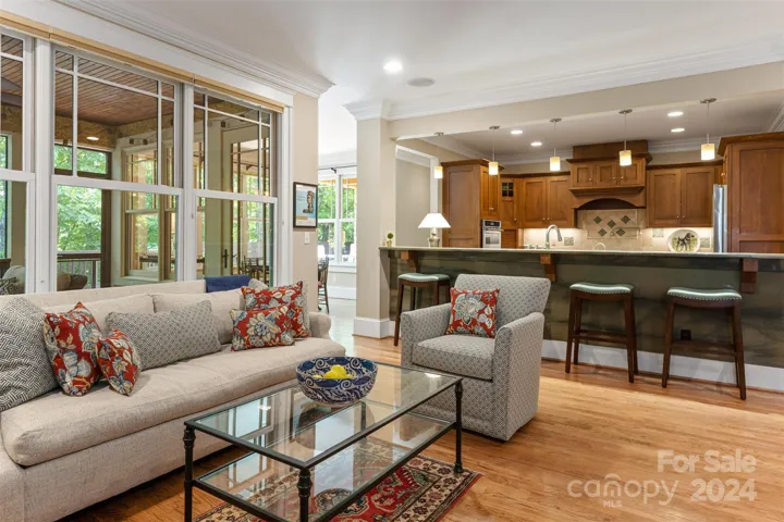 Family room open to kitchen, dining and outdoor patio