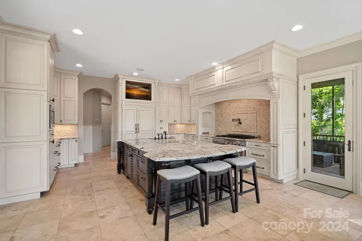 Screened patio off kitchen, with access to upper balcony