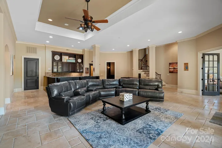 Utility room access to the left of the kitchen - HVACs #3 & #4, breaker boxes, storage, central vacuum