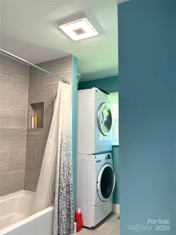 Main floor second full bathroom. Washer and dryer inside.