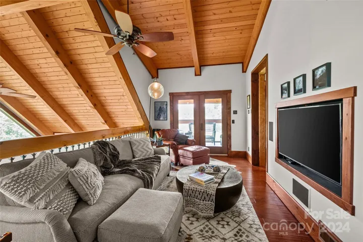 Upper level primary suite's den and loft space.