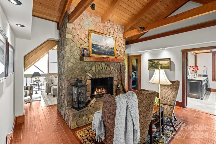 Upper level primary suite's den and loft space.