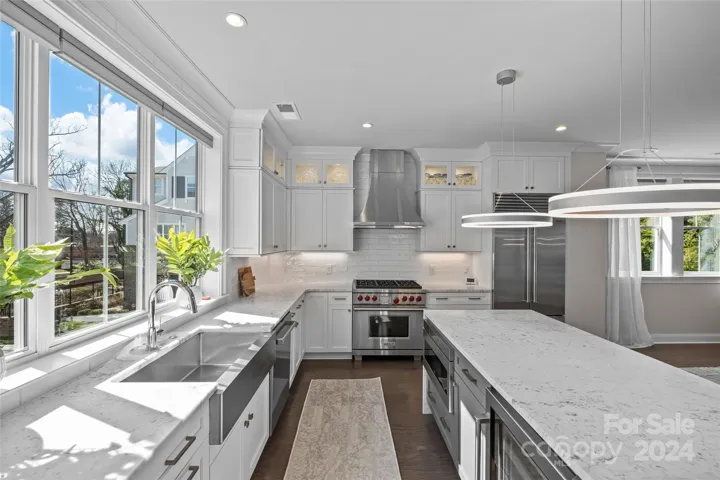 Gorgeous light filled Kitchen offers tons of counter and cabinet space!