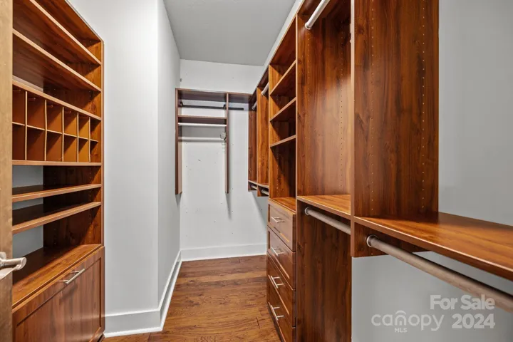 Walk-in primary closet with closet system