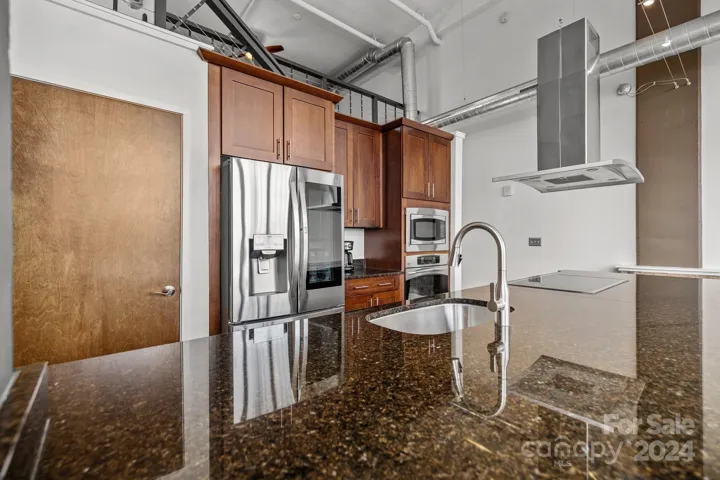 Gourmet kitchen with electric cooktop and wall oven