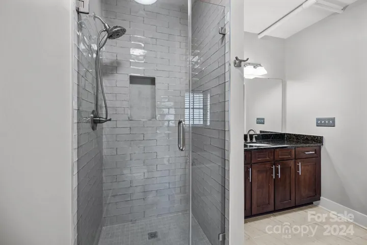 Renovated primary bathroom with tile shower