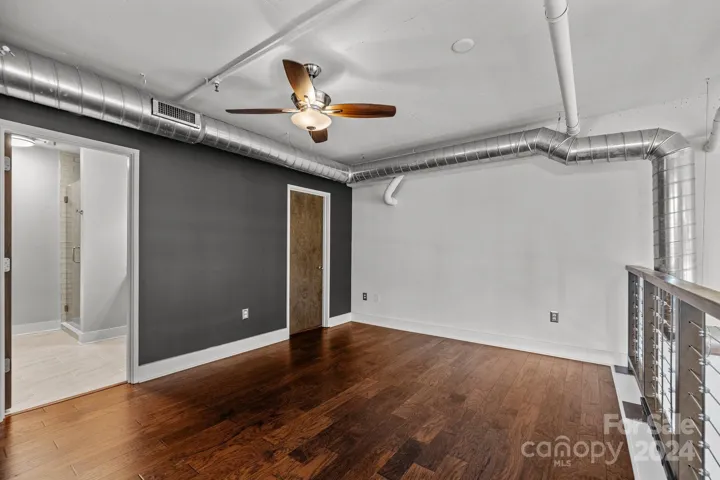 Primary bedroom with primary bath and walk-in closet