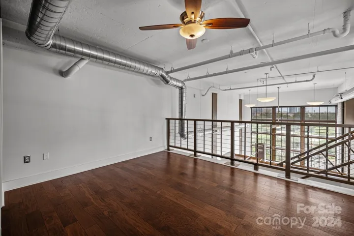 Primary bedroom/loft overlooking main living area